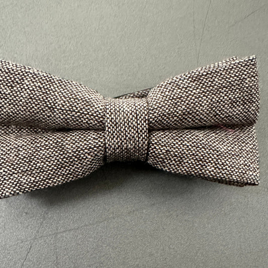 A brown wool bow tie for men.
