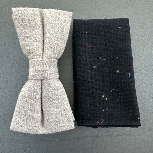 A cream wool bow tie and a black pocket square in wool.