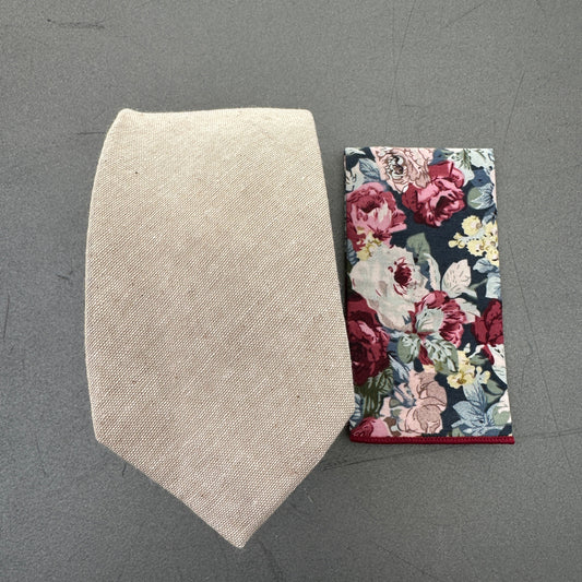 A beige tie and floral pocket square set ideal for weddings.