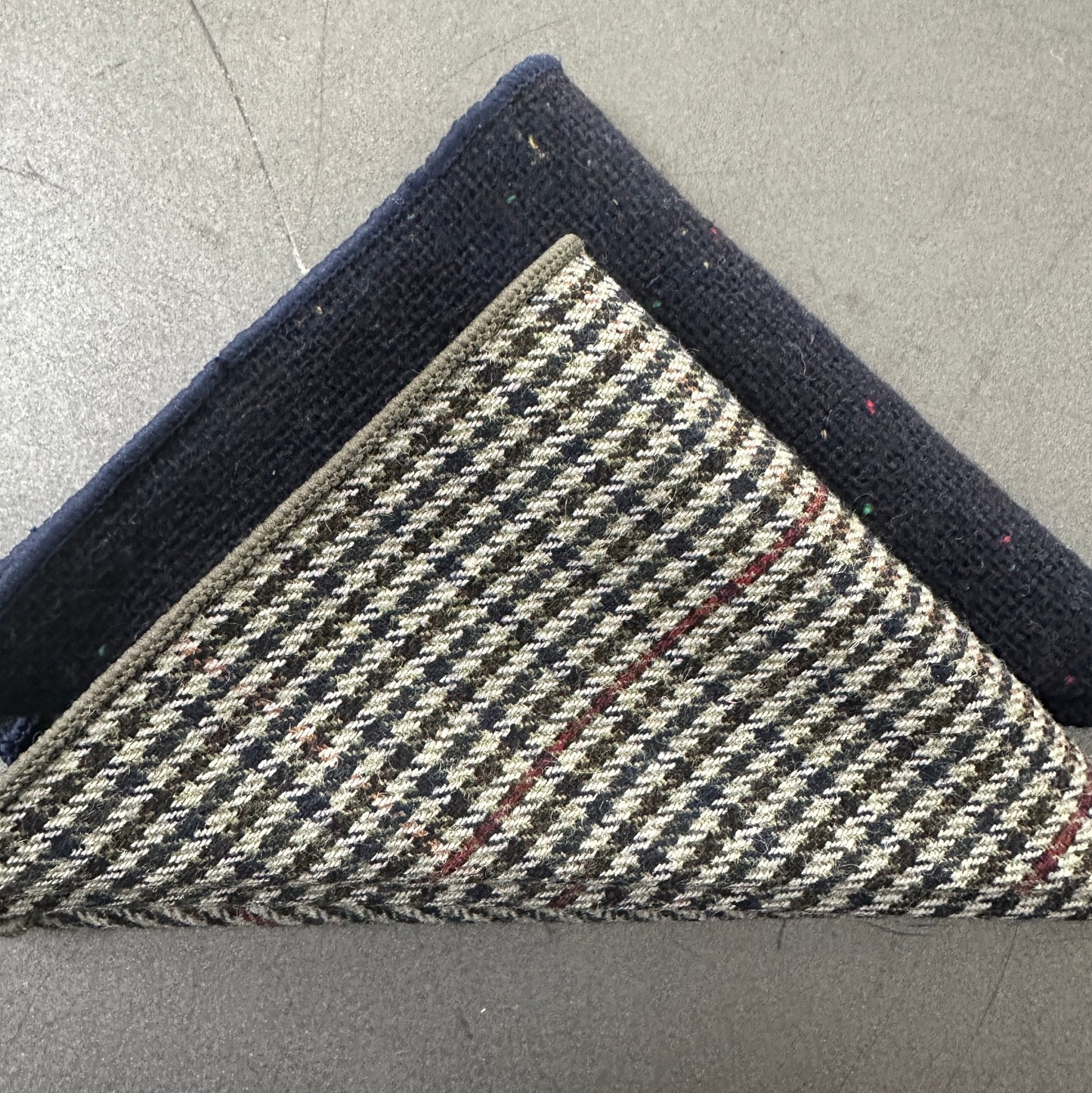 A two piece set of wool pocket squares for men. The set comes in checked grey and navy and make ideal EDC hanks and mens gifts. The set comes with free gift wrap and free UK shipping.