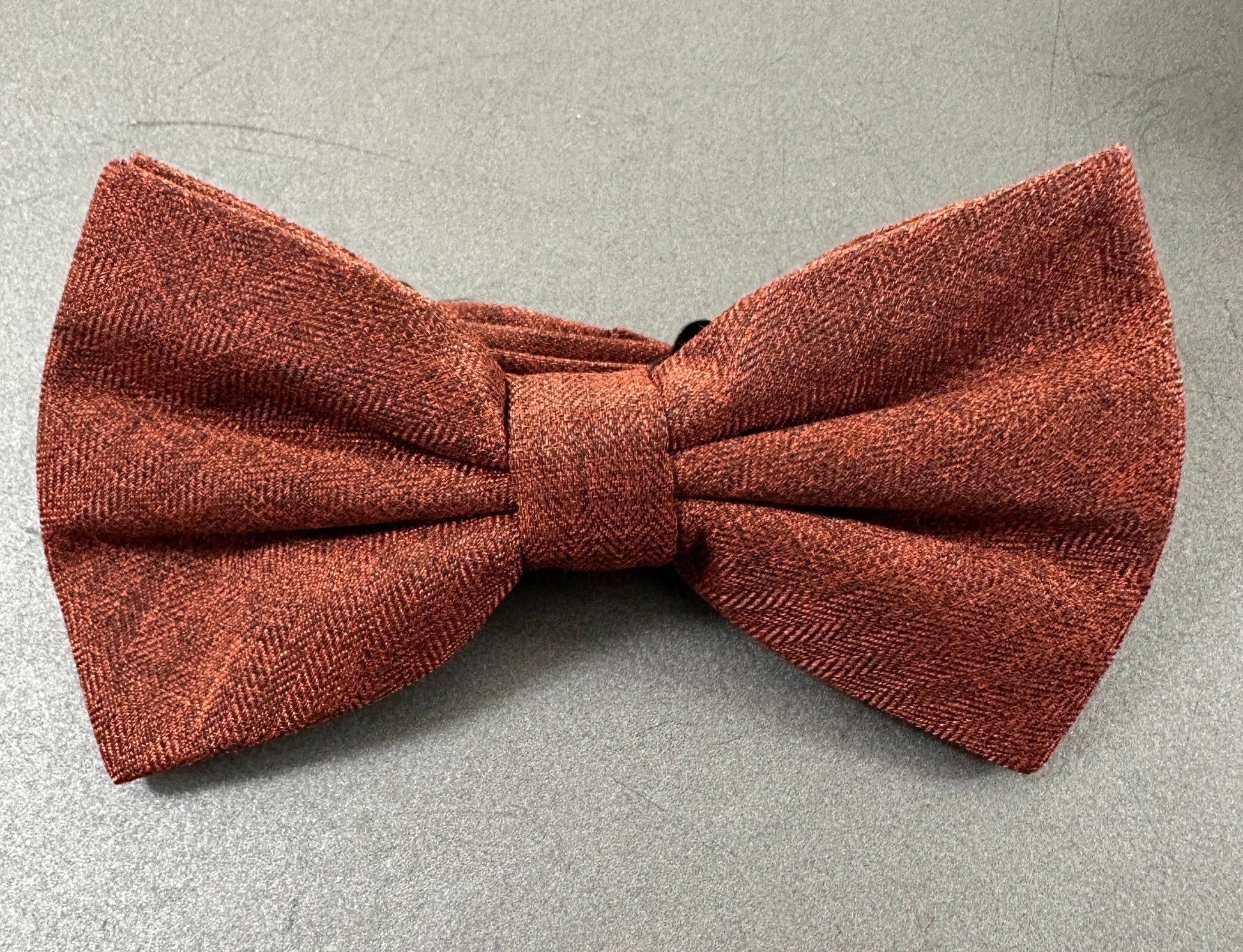 A burnt orange mens bow tie for weddings.