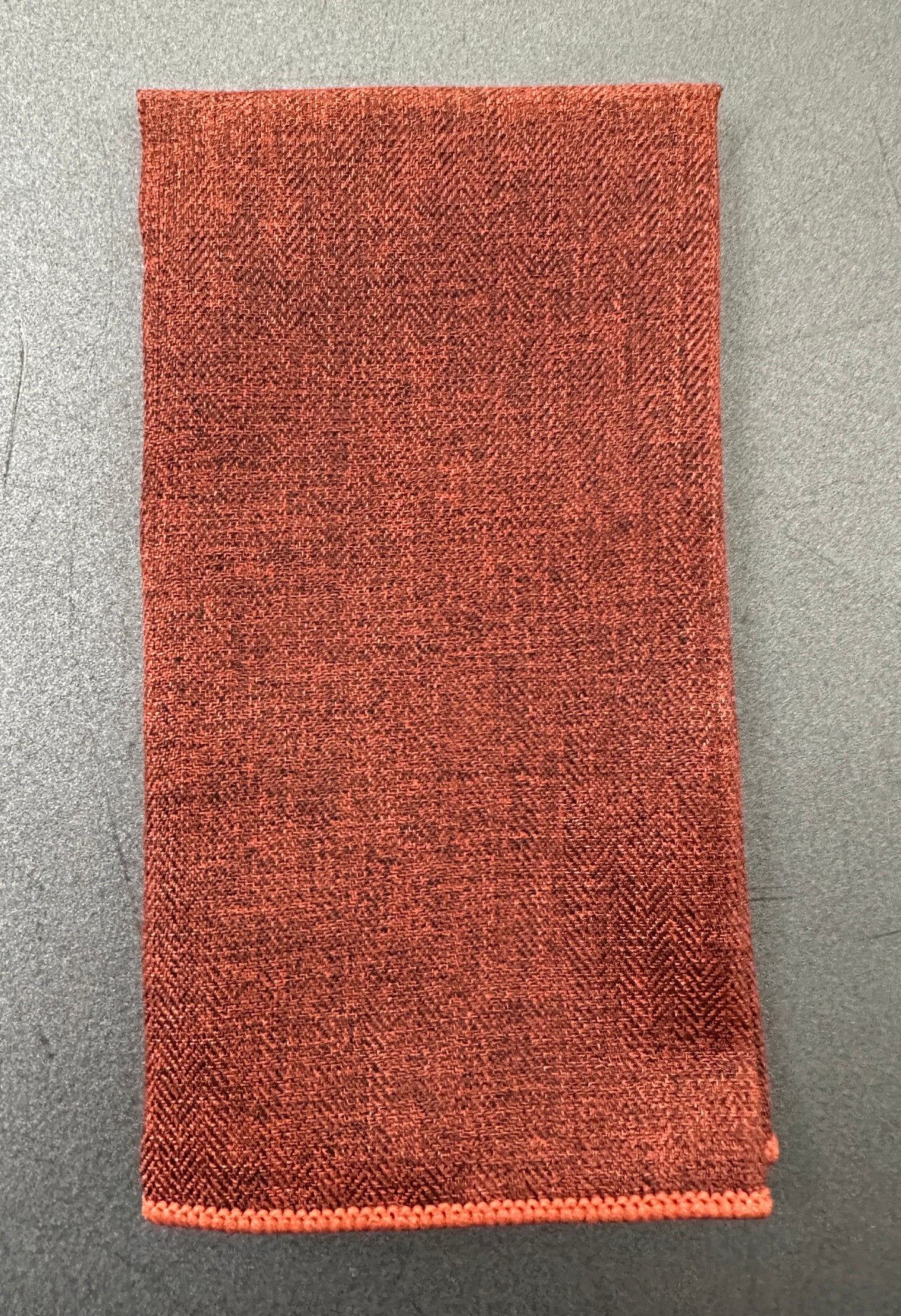 A burnt orange mens pocket square handkerchief for EDC hanks.