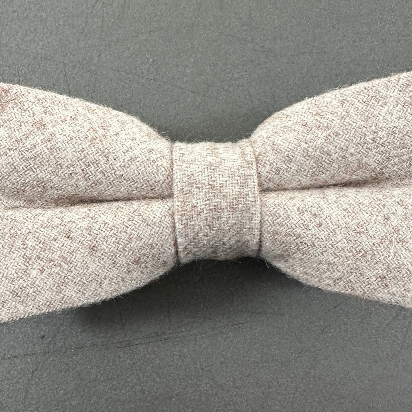 A cream wool bow tie for weddings and groomsmen.