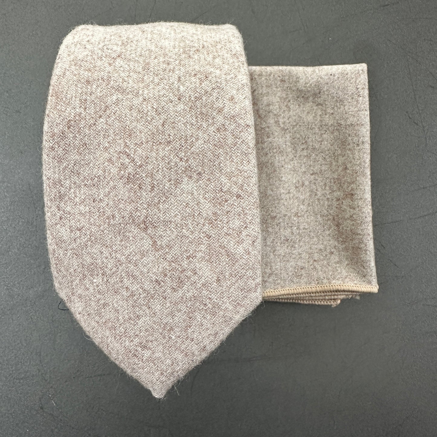 A cream wool tie and pocket square set for weddings and groomsmen.