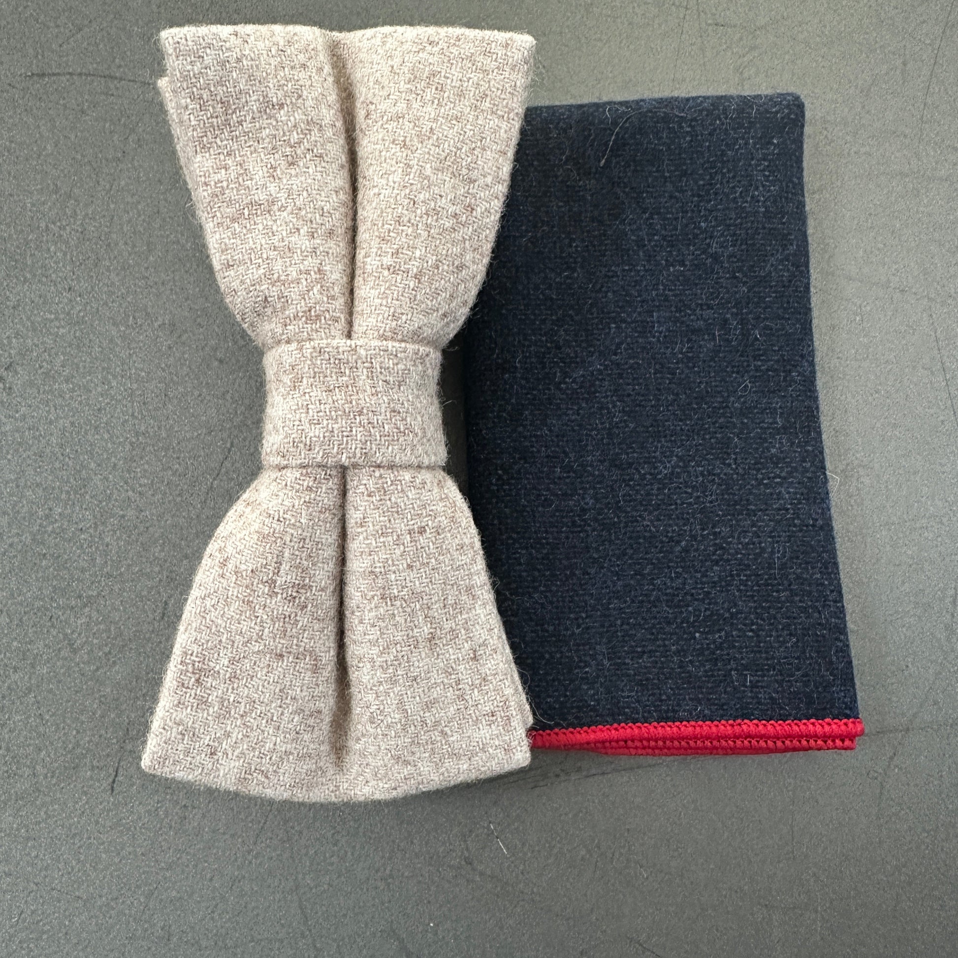 A cream wool pre-tied bow tie and pocket square set for weddings.