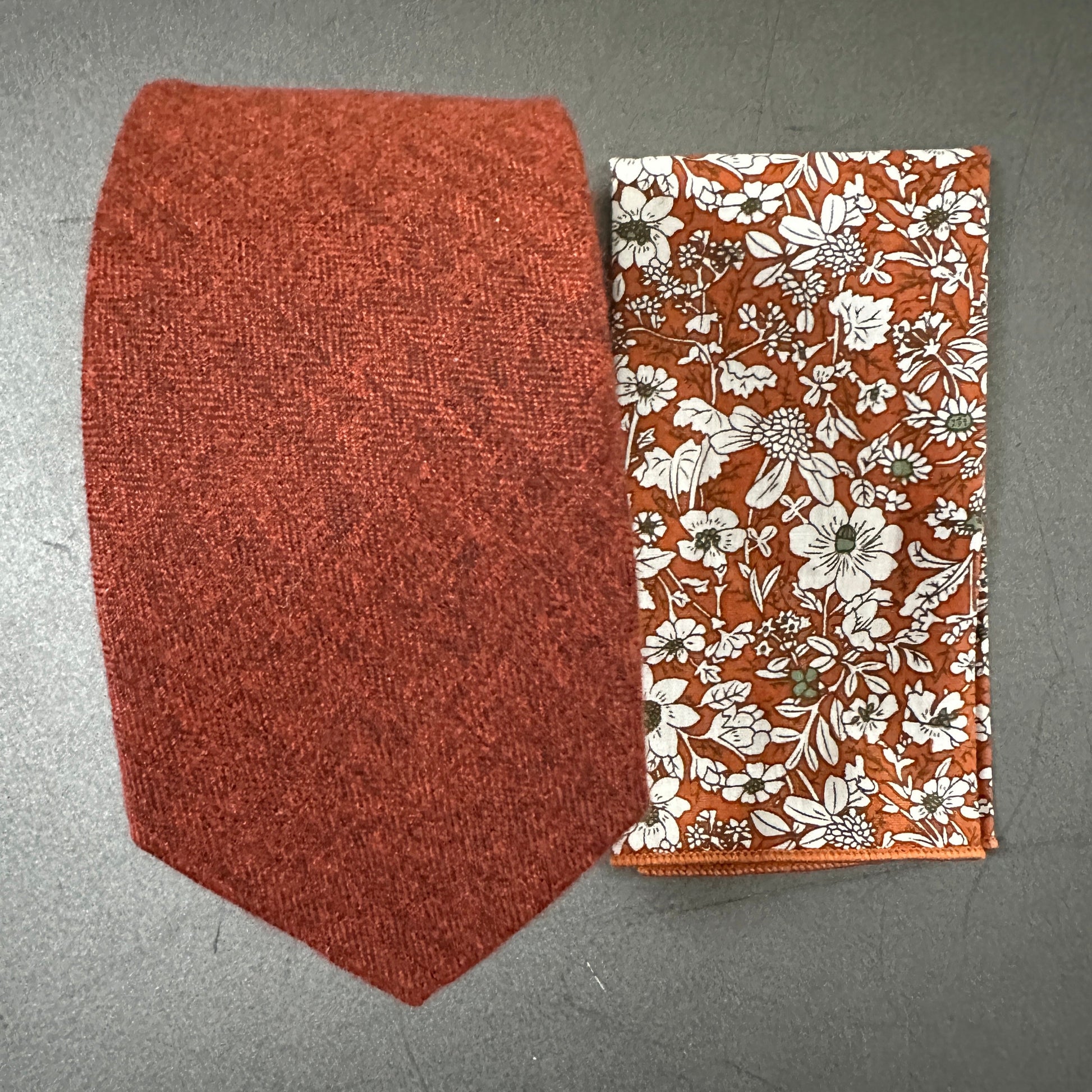 A burnt orange mens tie and pocket square set ideal for wedding ties.