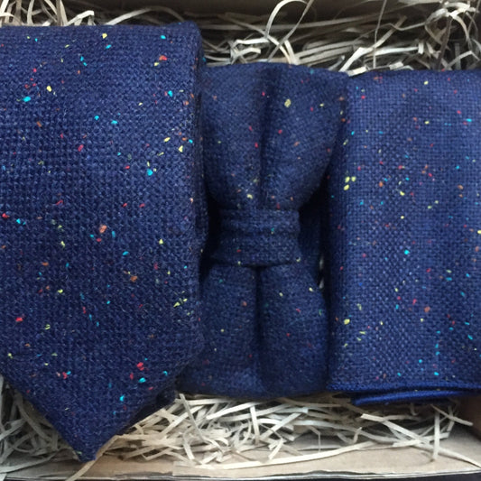 A navy wool men's tie, bow tie and pocket square. The set includes free gift wrapping and so is perfect for men's giifts, wedding ties and grooms men gifts. Our ties are handmade at Daisy and Oak Studio