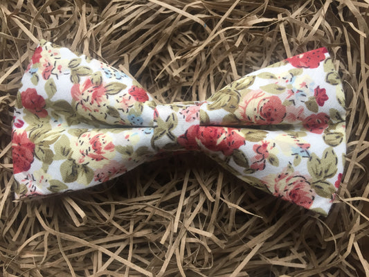 A pink, floral men's bow tie. This dickie bow is  ideal as a wedding bow tie and for formal wear. The bow tie is handmade by Daisy and Oak Studio, UK